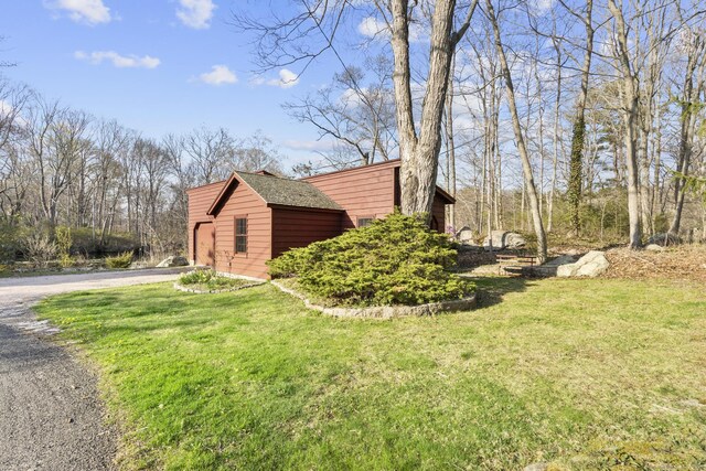 55-69 Sawmill Rd, Branford, CT 06405 - view of property exterior with gravel driveway and a yard
