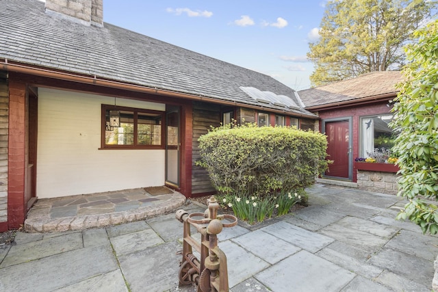 55-69 Sawmill Rd, Branford, CT 06405 - entrance to property featuring a chimney and a patio area