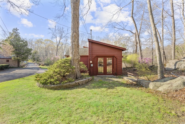 55-69 Sawmill Rd, Branford, CT 06405 - view of home's exterior with a lawn and french doors