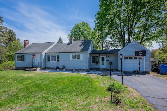 ranch-style house with a garage, a chimney, driveway, and a front lawn