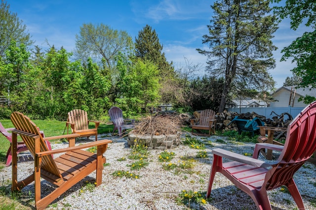 view of yard with a fire pit