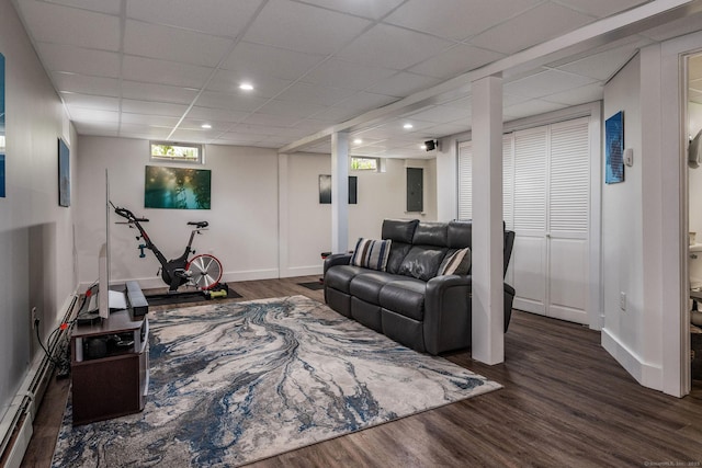 living room featuring recessed lighting, baseboards, and wood finished floors