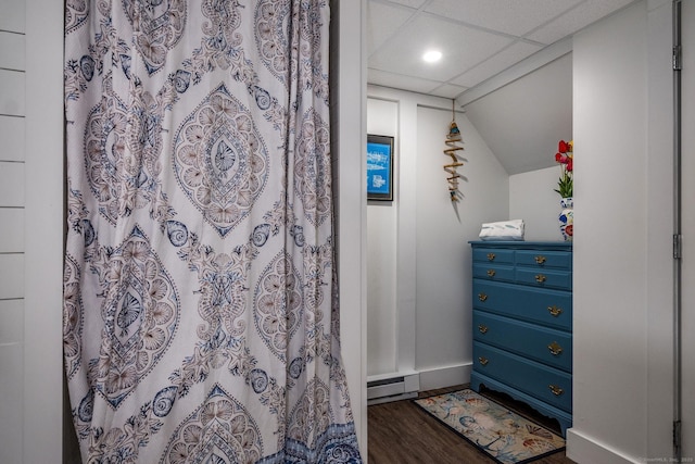 bathroom featuring wood finished floors, baseboards, a shower with shower curtain, recessed lighting, and vaulted ceiling