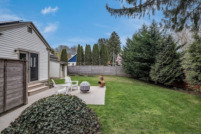 view of yard with a fenced backyard and a patio area