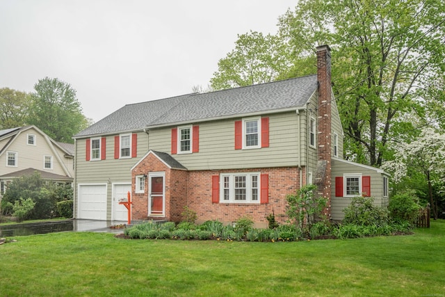 20 Fairview St, Simsbury, CT 06070 - view of front facade with a chimney, a front lawn, brick siding, and a garage
