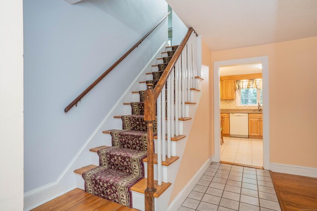 20 Fairview St, Simsbury, CT 06070 - stairs featuring baseboards and tile patterned floors