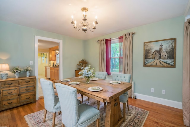 20 Fairview St, Simsbury, CT 06070 - dining space with baseboards, a notable chandelier, and light wood-style floors