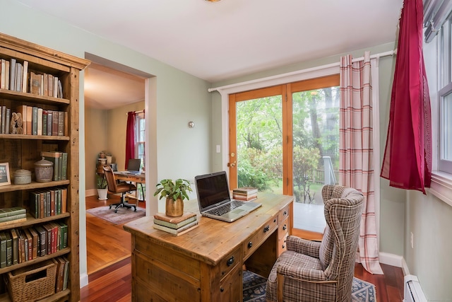 20 Fairview St, Simsbury, CT 06070 - home office featuring a baseboard radiator, baseboards, and wood finished floors
