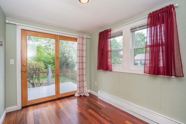 20 Fairview St, Simsbury, CT 06070 - doorway to outside with wood-type flooring, baseboards, and a baseboard heating unit