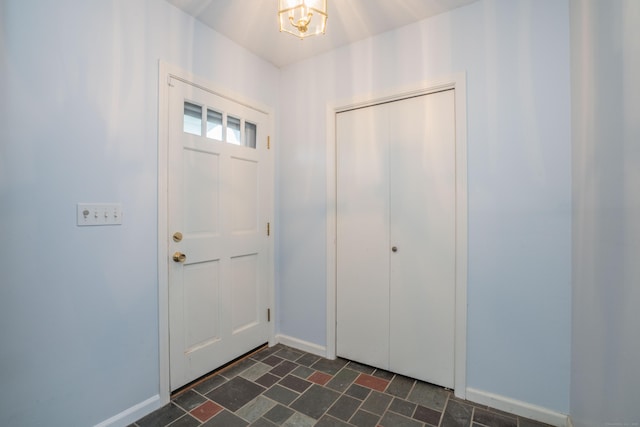 20 Fairview St, Simsbury, CT 06070 - foyer entrance featuring a chandelier and baseboards