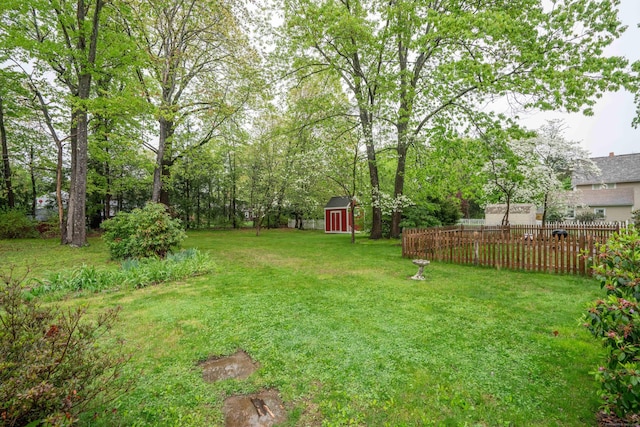 20 Fairview St, Simsbury, CT 06070 - view of yard featuring a storage shed, fence, and an outdoor structure