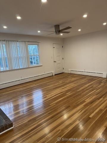 71 Schiller Rd, Fairfield, CT 06825 - spare room with a baseboard heating unit, wood finished floors, a ceiling fan, and recessed lighting