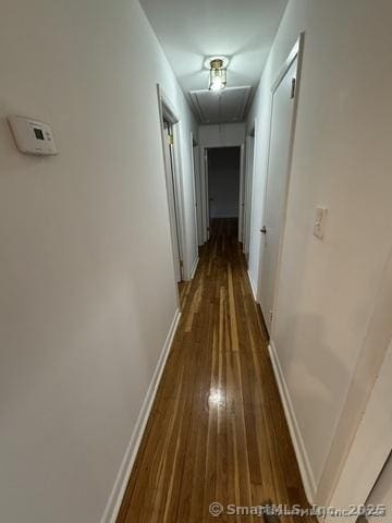 71 Schiller Rd, Fairfield, CT 06825 - hall with attic access, baseboards, and dark wood-type flooring