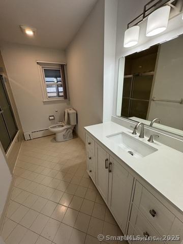 71 Schiller Rd, Fairfield, CT 06825 - full bath with a shower with shower door, toilet, vanity, and tile patterned floors