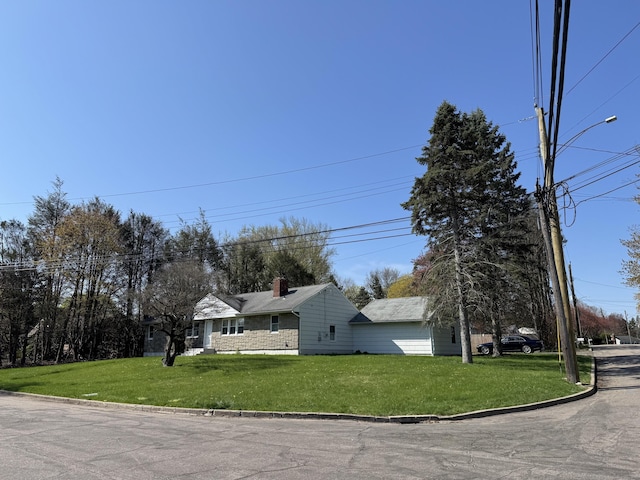 71 Schiller Rd, Fairfield, CT 06825 - view of front of house featuring a chimney and a front yard