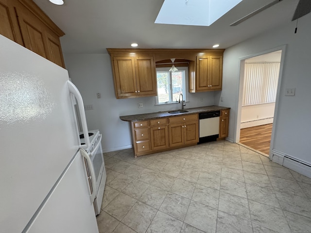 71 Schiller Rd, Fairfield, CT 06825 - kitchen with a baseboard radiator, brown cabinets, a sink, and white appliances