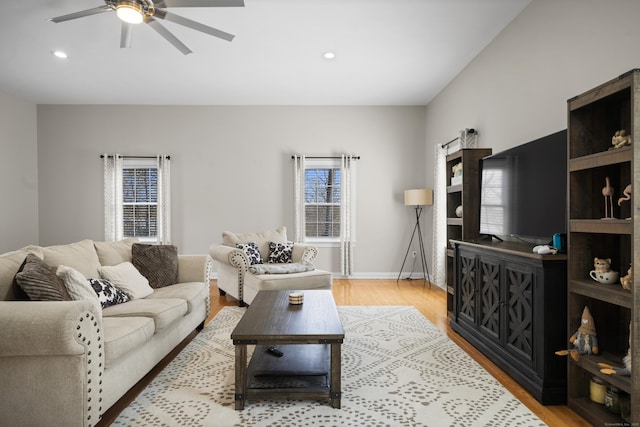 living area featuring a ceiling fan, light wood-style flooring, recessed lighting, and baseboards