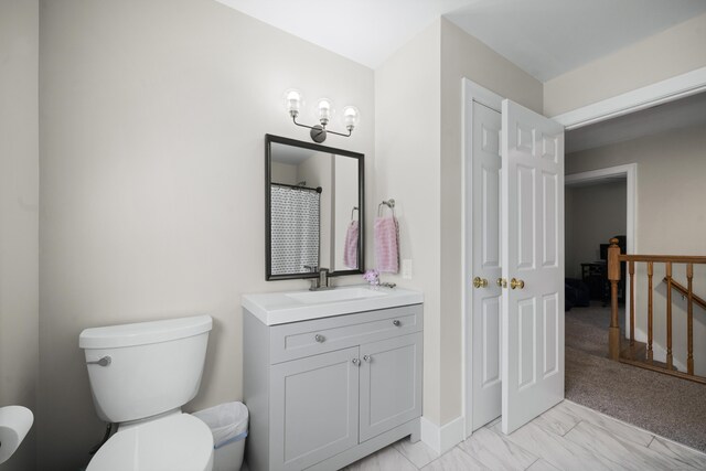 full bathroom featuring baseboards, marble finish floor, toilet, and vanity
