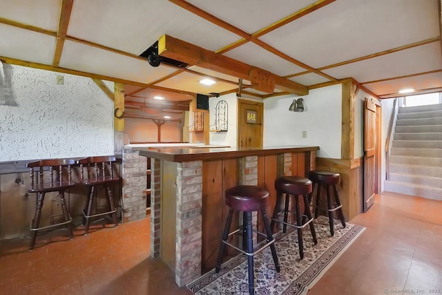 bar with a dry bar and stairway