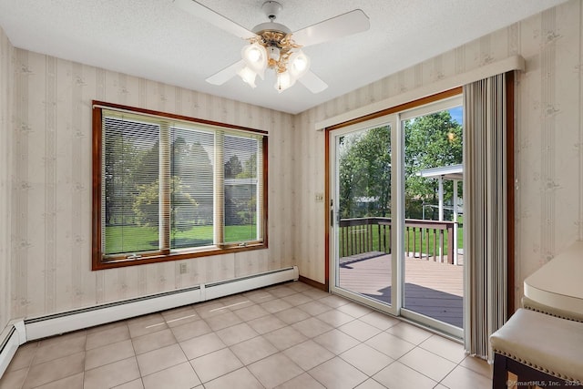 entryway with baseboards, a baseboard radiator, ceiling fan, and wallpapered walls