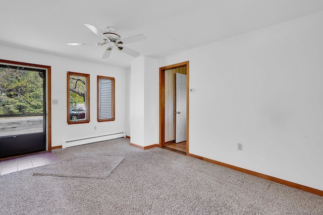 carpeted empty room with baseboards, baseboard heating, and a ceiling fan