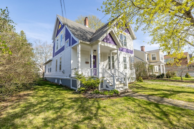 16 Pearl St, Groton, CT 06355 - view of side of property with a porch, a lawn, and a chimney
