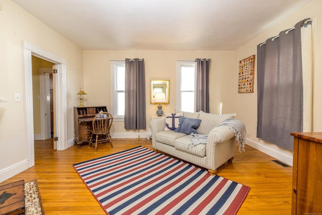 16 Pearl St, Groton, CT 06355 - living room featuring baseboards, wood finished floors, and visible vents