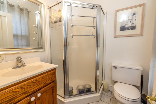 16 Pearl St, Groton, CT 06355 - full bathroom featuring vanity, tile patterned floors, a shower stall, and toilet