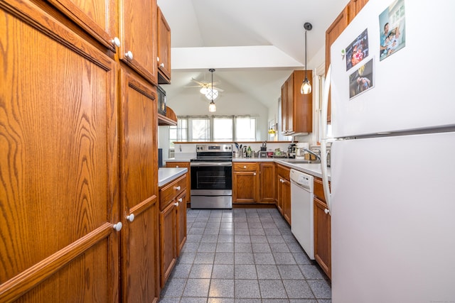 16 Pearl St, Groton, CT 06355 - kitchen featuring vaulted ceiling, brown cabinets, a sink, light countertops, and white appliances