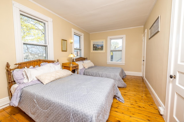 16 Pearl St, Groton, CT 06355 - bedroom featuring crown molding, baseboards, multiple windows, and light wood finished floors
