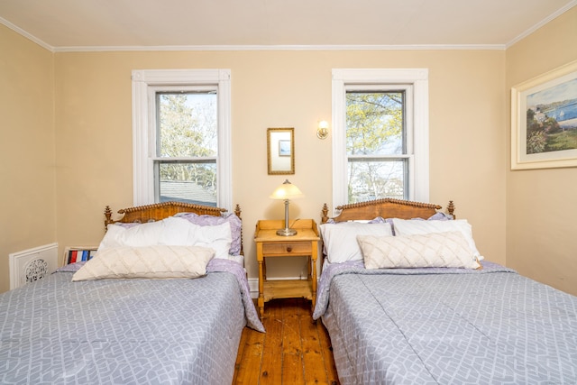 16 Pearl St, Groton, CT 06355 - bedroom featuring crown molding, multiple windows, and hardwood / wood-style flooring