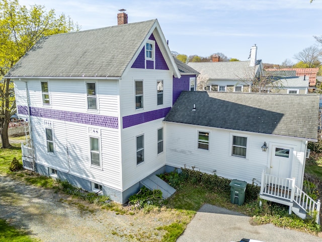 16 Pearl St, Groton, CT 06355 - back of property featuring a shingled roof and a chimney