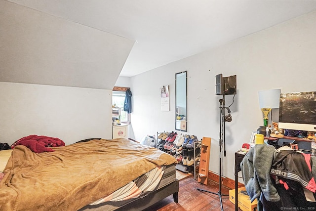 bedroom with wood finished floors