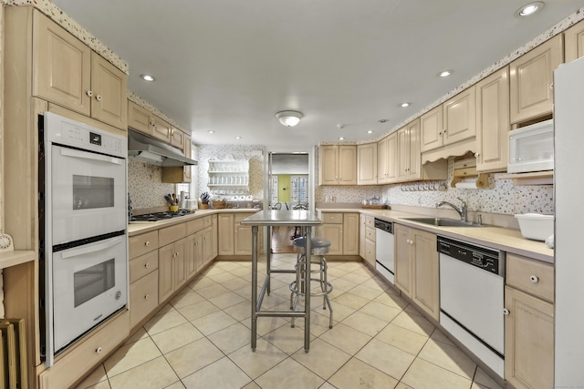802 State Rd, Richmond, MA 01254 - kitchen featuring light brown cabinetry, under cabinet range hood, a sink, and white appliances