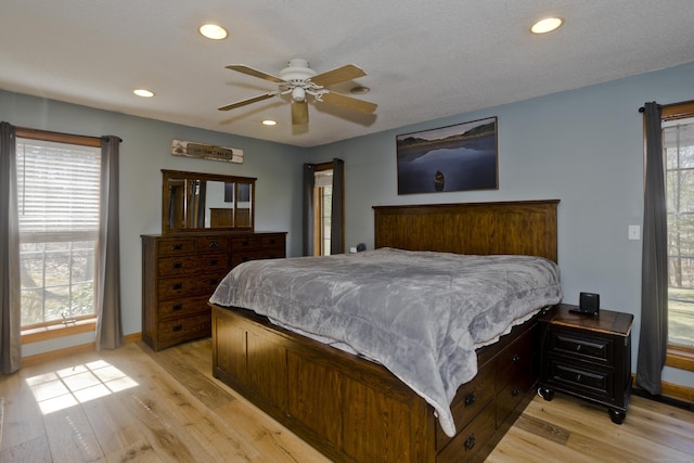 bedroom featuring ceiling fan, light wood-style flooring, baseboards, and recessed lighting