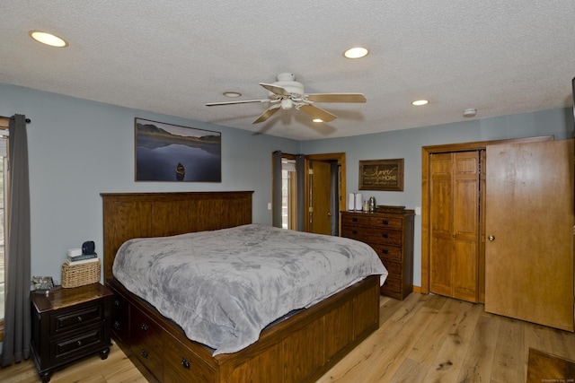 bedroom with recessed lighting, ceiling fan, light wood-type flooring, and a textured ceiling