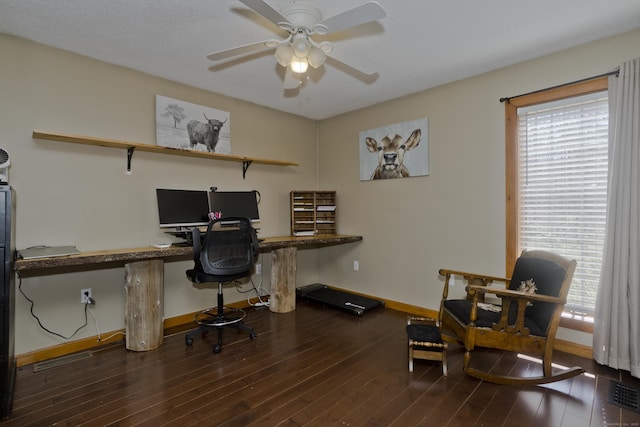 office with baseboards, a healthy amount of sunlight, a ceiling fan, and wood finished floors