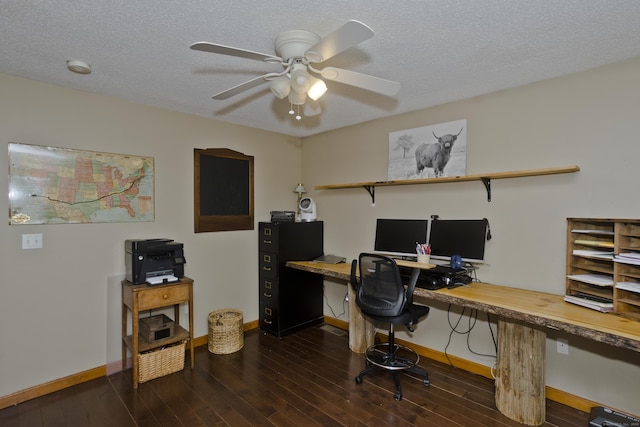 home office with a textured ceiling, dark wood-style flooring, baseboards, and ceiling fan