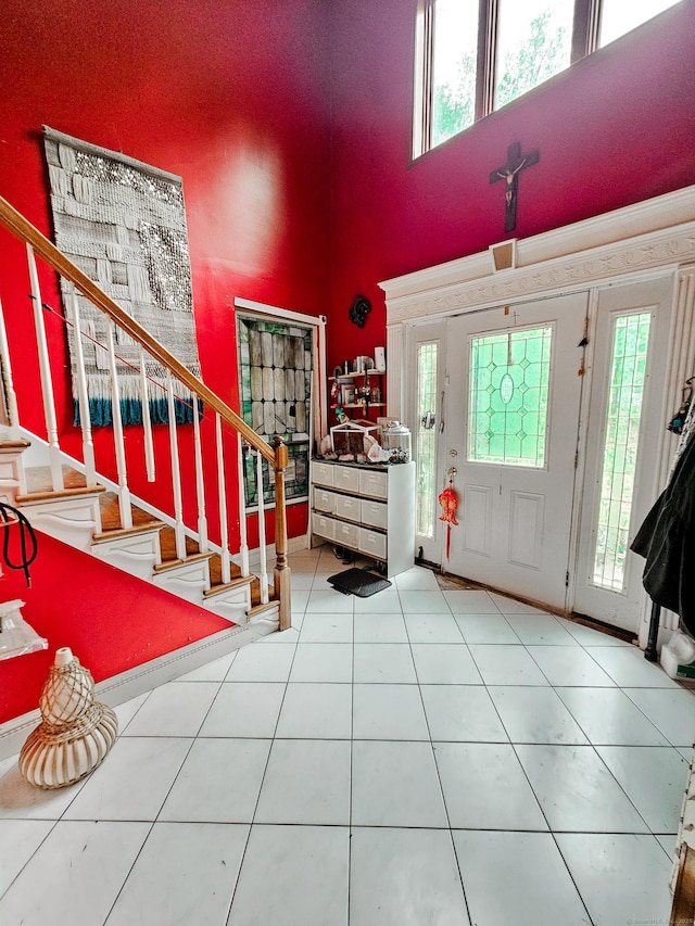 935 Gaylord Mountain Rd, Hamden, CT 06518 - entryway with plenty of natural light, stairs, a towering ceiling, and tile patterned flooring