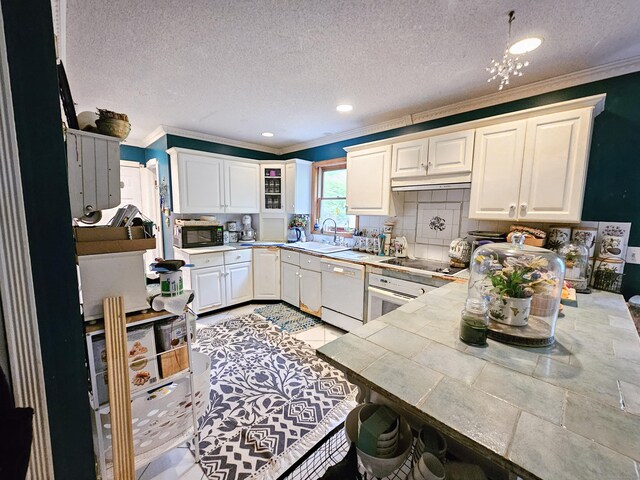 935 Gaylord Mountain Rd, Hamden, CT 06518 - kitchen featuring black appliances, crown molding, white cabinets, a sink, and a textured ceiling