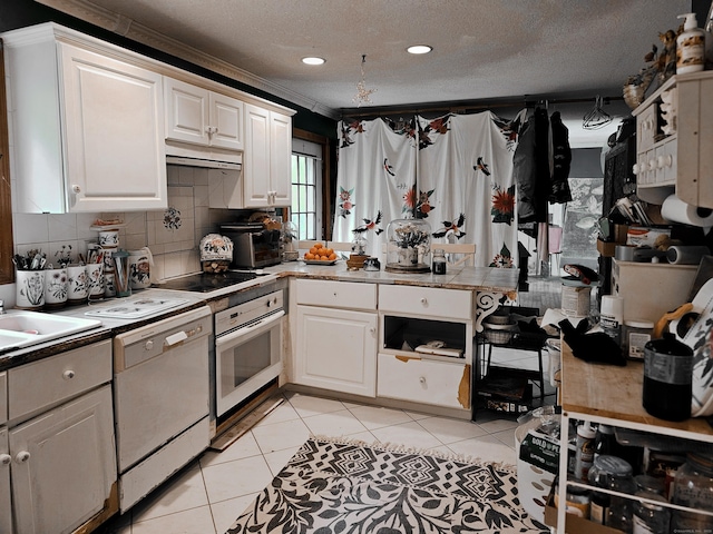 935 Gaylord Mountain Rd, Hamden, CT 06518 - kitchen featuring white appliances, light tile patterned floors, white cabinets, a textured ceiling, and tasteful backsplash