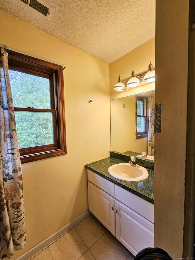935 Gaylord Mountain Rd, Hamden, CT 06518 - bathroom with tile patterned floors, a textured ceiling, vanity, and baseboards