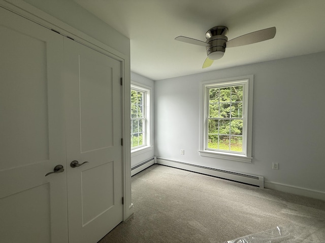 439 New Hanover Ave, Meriden, CT 06451 - unfurnished bedroom featuring a baseboard heating unit, carpet, and multiple windows