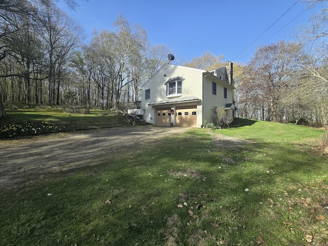 120 Roosevelt Avenue Extension, Litchfield, CT 06750 - view of side of home with an attached garage, a chimney, driveway, and a yard