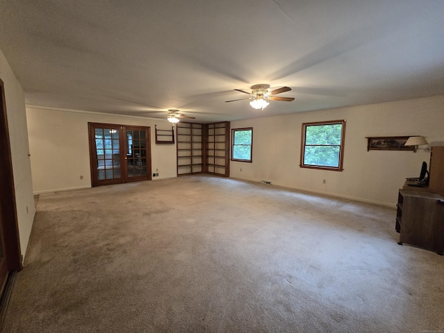 120 Roosevelt Avenue Extension, Litchfield, CT 06750 - unfurnished living room featuring light carpet, ceiling fan, baseboards, and french doors