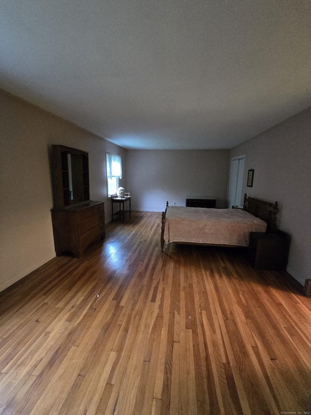 120 Roosevelt Avenue Extension, Litchfield, CT 06750 - bedroom featuring wood finished floors and a fireplace