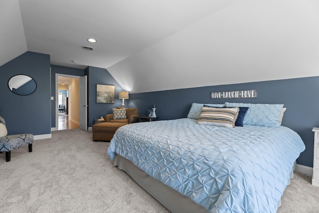 carpeted bedroom featuring baseboards, visible vents, and lofted ceiling