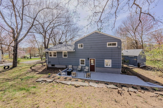 106 Lorraine Ter, Middletown, CT 06457 - back of property with an outdoor structure, a chimney, and a patio area