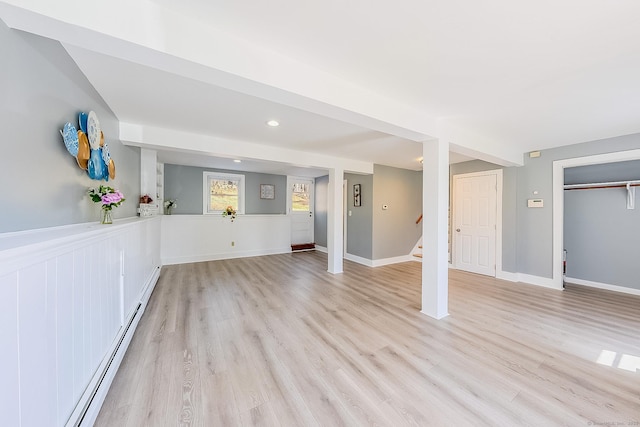 106 Lorraine Ter, Middletown, CT 06457 - basement featuring a baseboard radiator, light wood-type flooring, and stairs