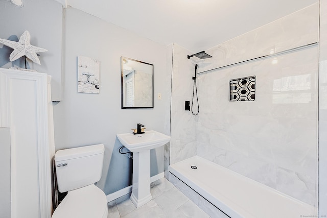 106 Lorraine Ter, Middletown, CT 06457 - bathroom with baseboards, tiled shower, toilet, and marble finish floor